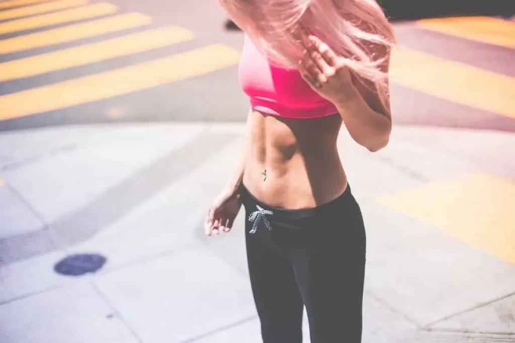 Woman with toned stomach after LA-EMS Body Sculpting Treatment Brent Park
